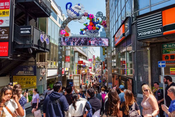 istockphoto-2153076189-612×612 Tokyo, Japan, April 15, 2024: Crowds of tourists in Takeshita street in Harajuku Tokyo Japan.